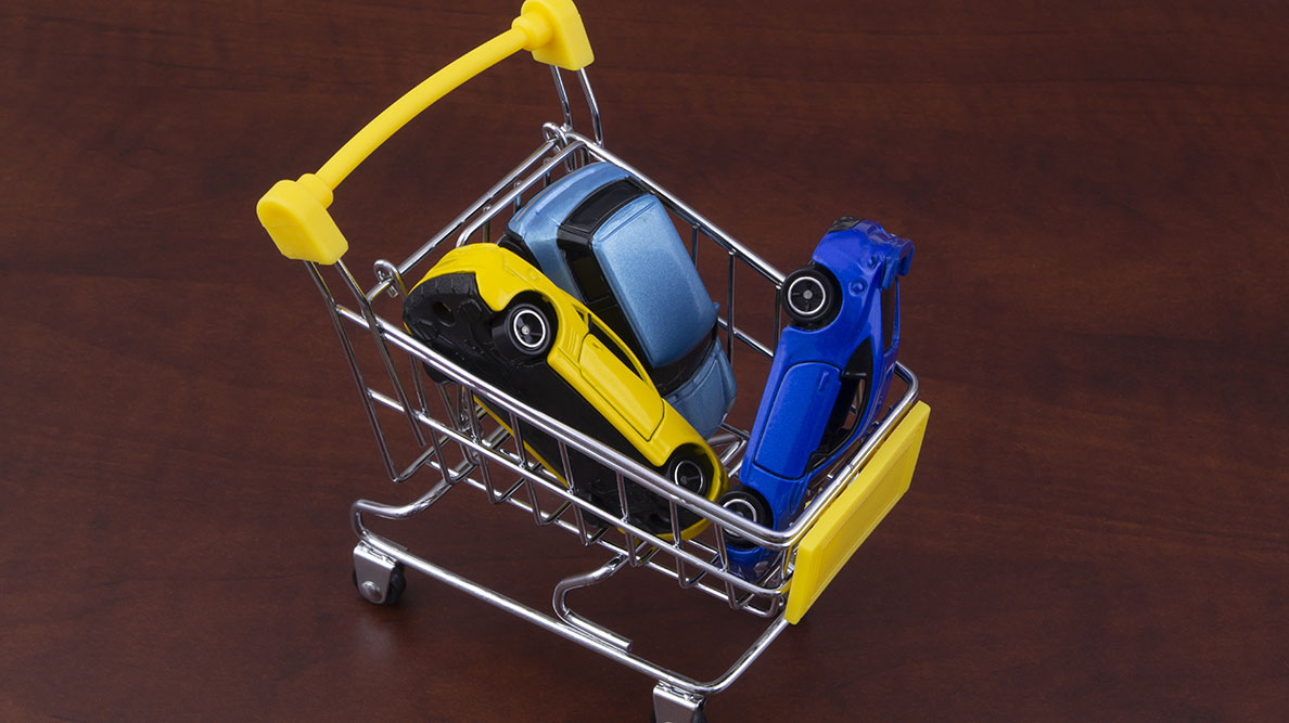 Shopping cart filled with car toys